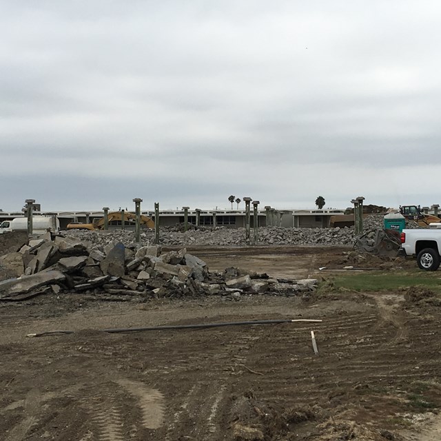 A building at La Quinta is demolished to make way for three new classroom buildings.  
