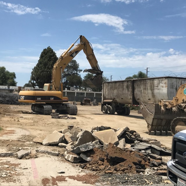 Removing debris from the demolished building.